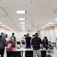 Students in classroom around the table